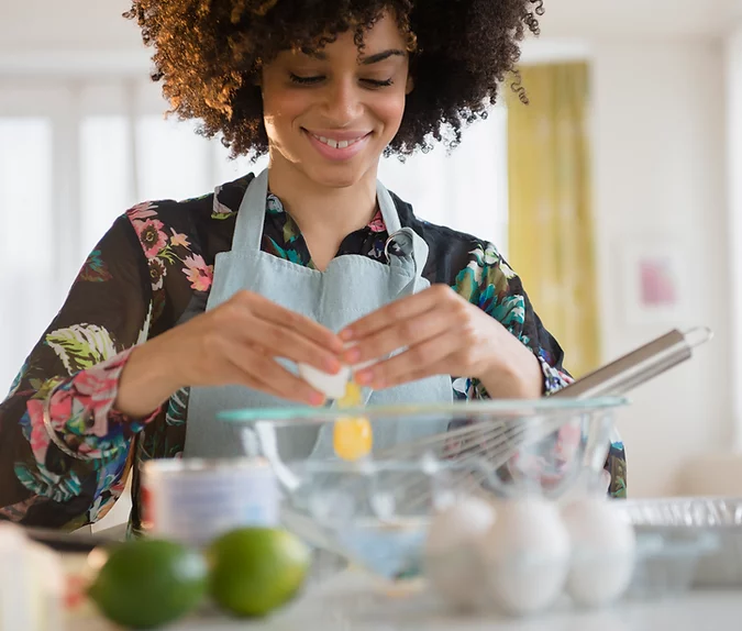 a lady caregiver preparing a meal