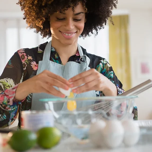 a lady caregiver preparing a meal